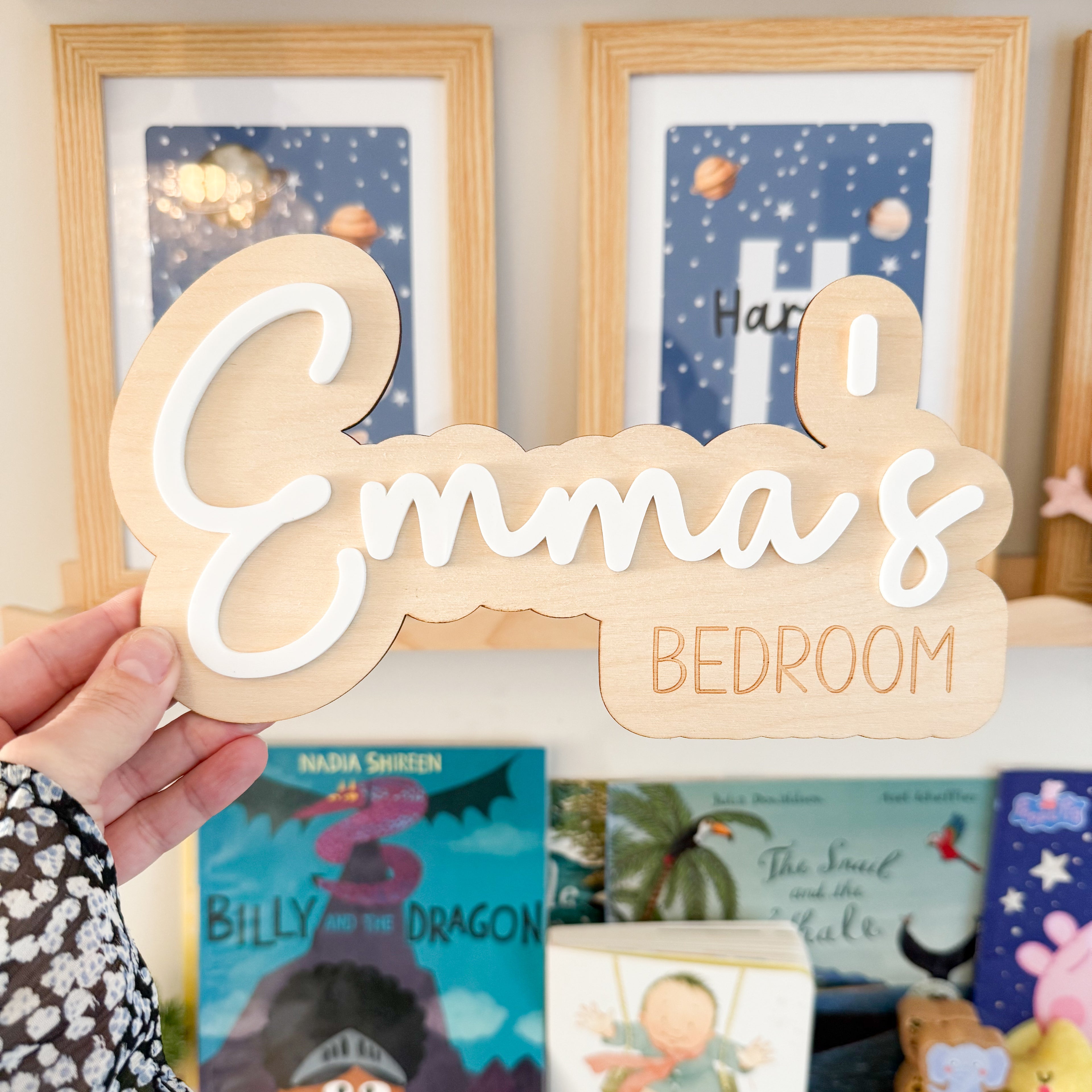 A wooden sign with the name "Emma&