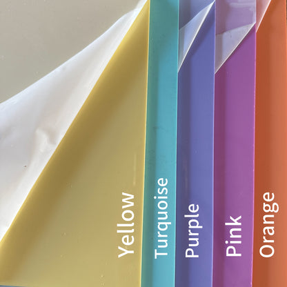 A collection of colorful plastic sheets, each with a different color name written on it.